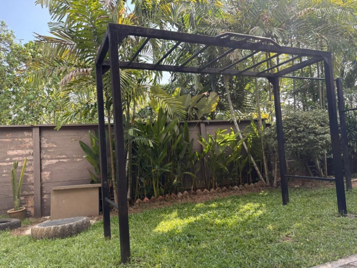 Outdoor calisthenics rig at Bambu Getaway, Langkawi, with palms and jungle