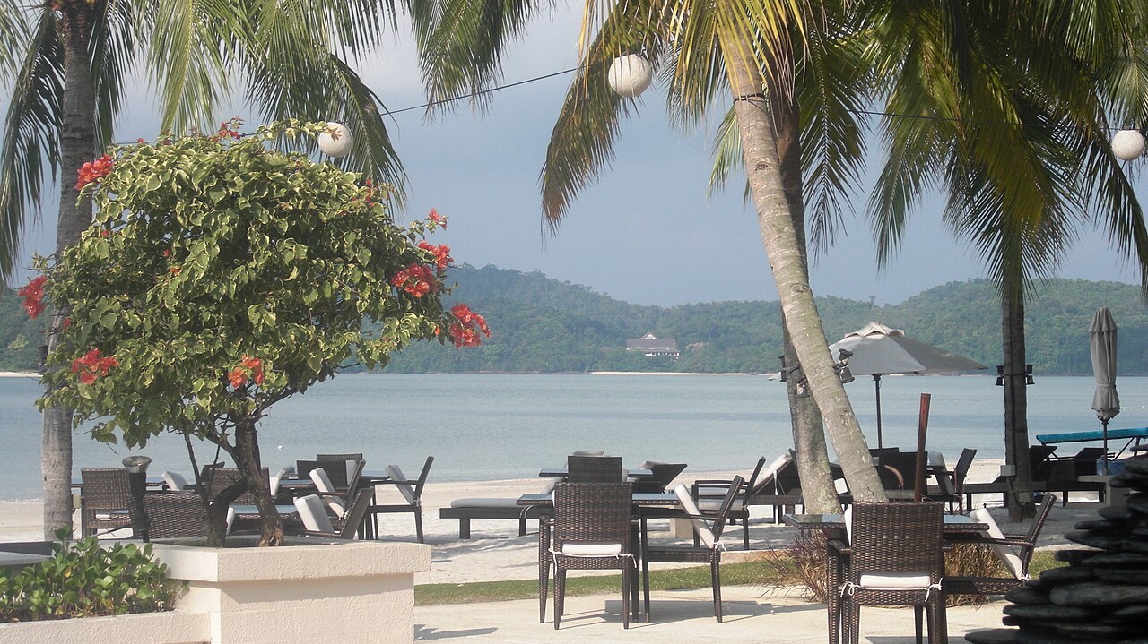 Open-air beach restaurant at dusk, Langkawi southwest coast