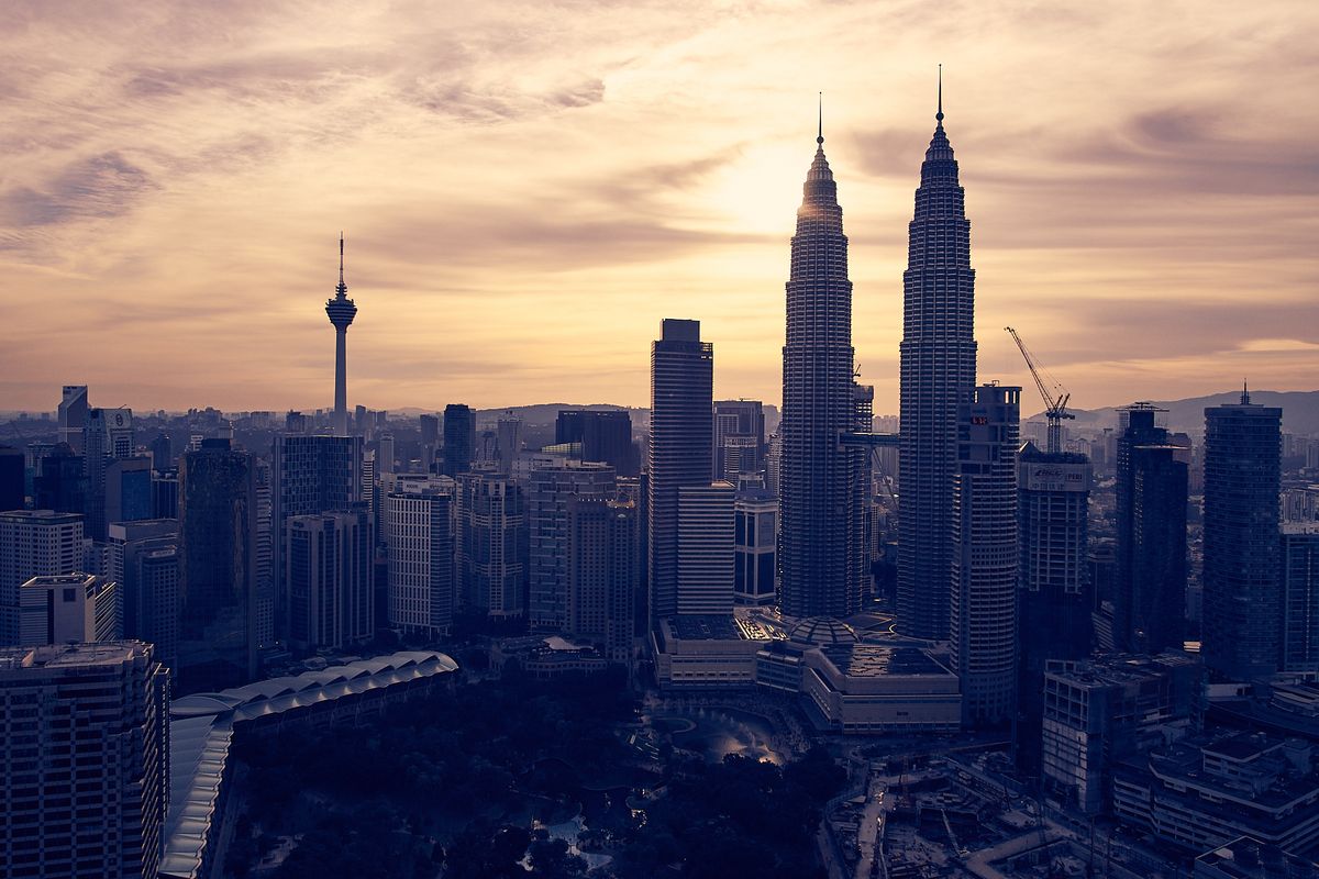 Petronas Towers and the Kuala Lumpur skyline at sunset, Malaysia