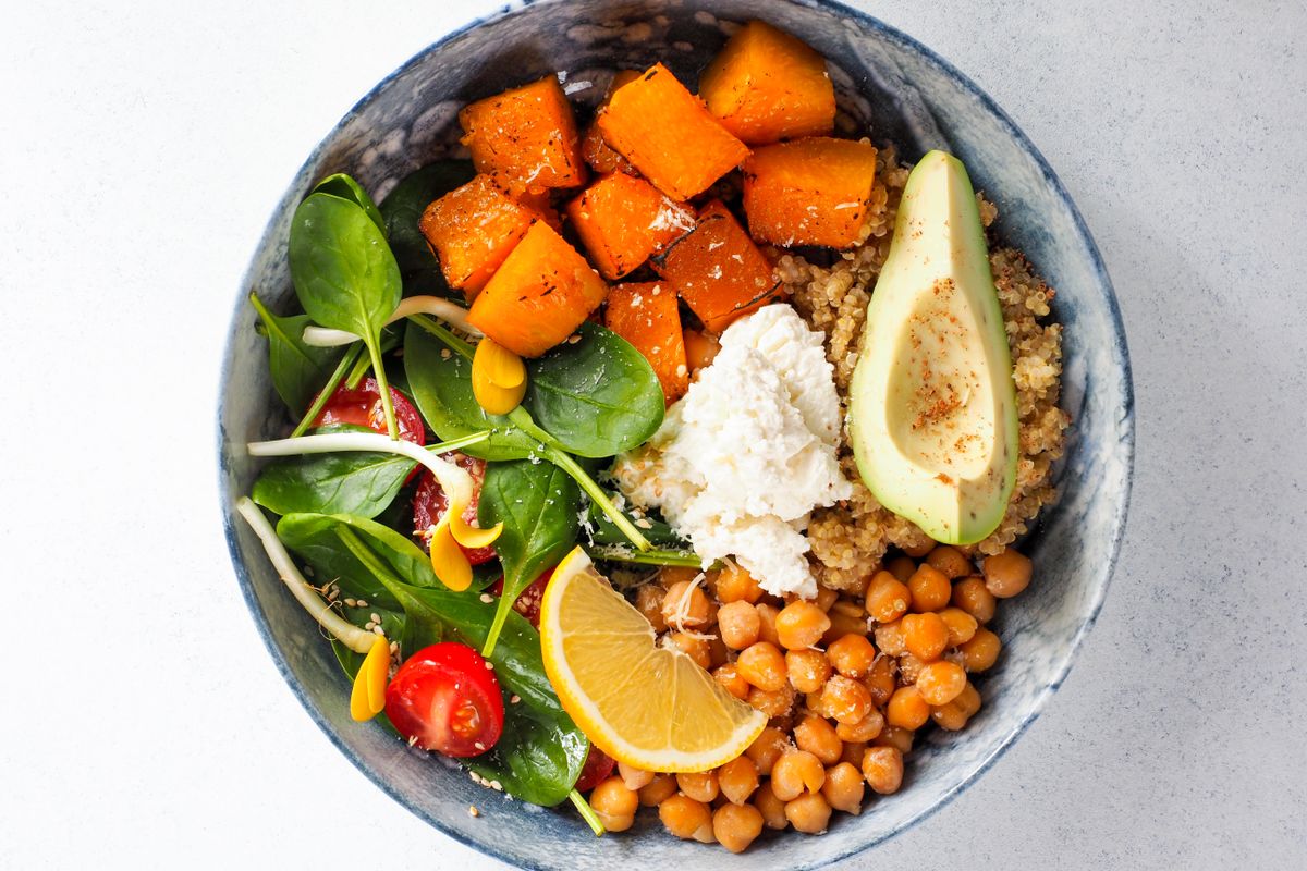 Colourful plant-based bowl with quinoa, chickpeas, roasted squash, avocado and greens, illustrative of vegan dining in Langkawi