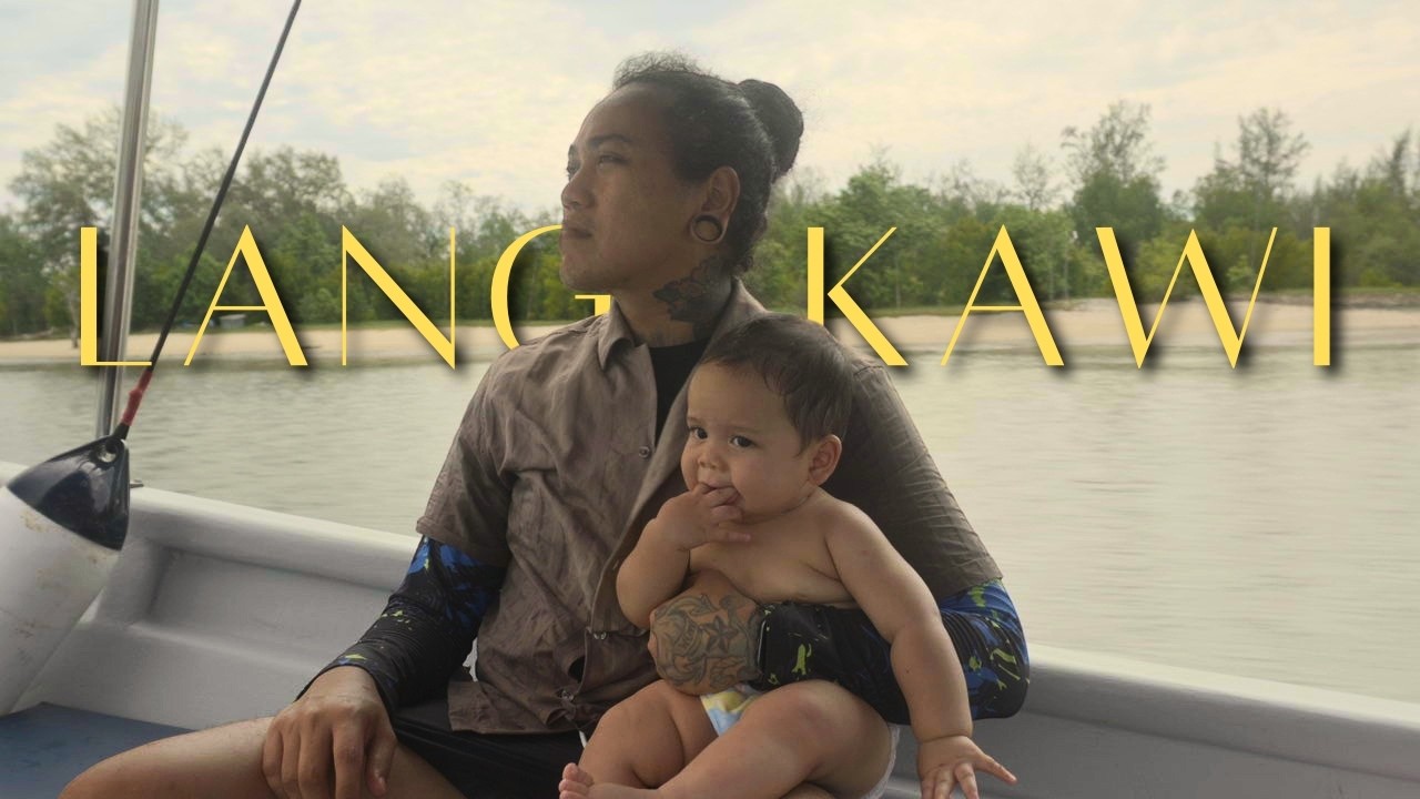 A father and baby on a mangrove boat during a Langkawi family tour